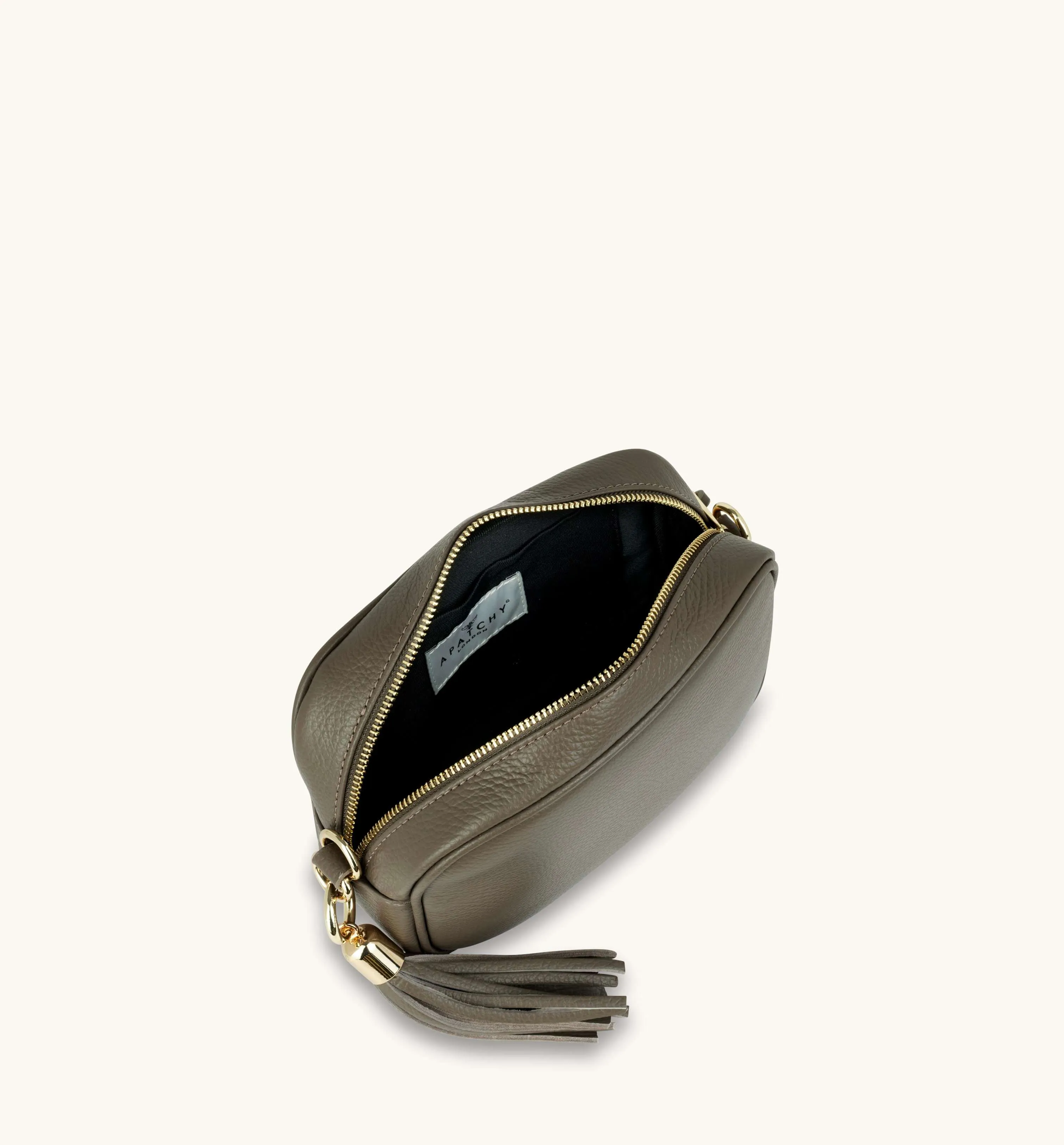 The Tassel Latte Leather Crossbody Bag With Black & Gold Chevron Strap