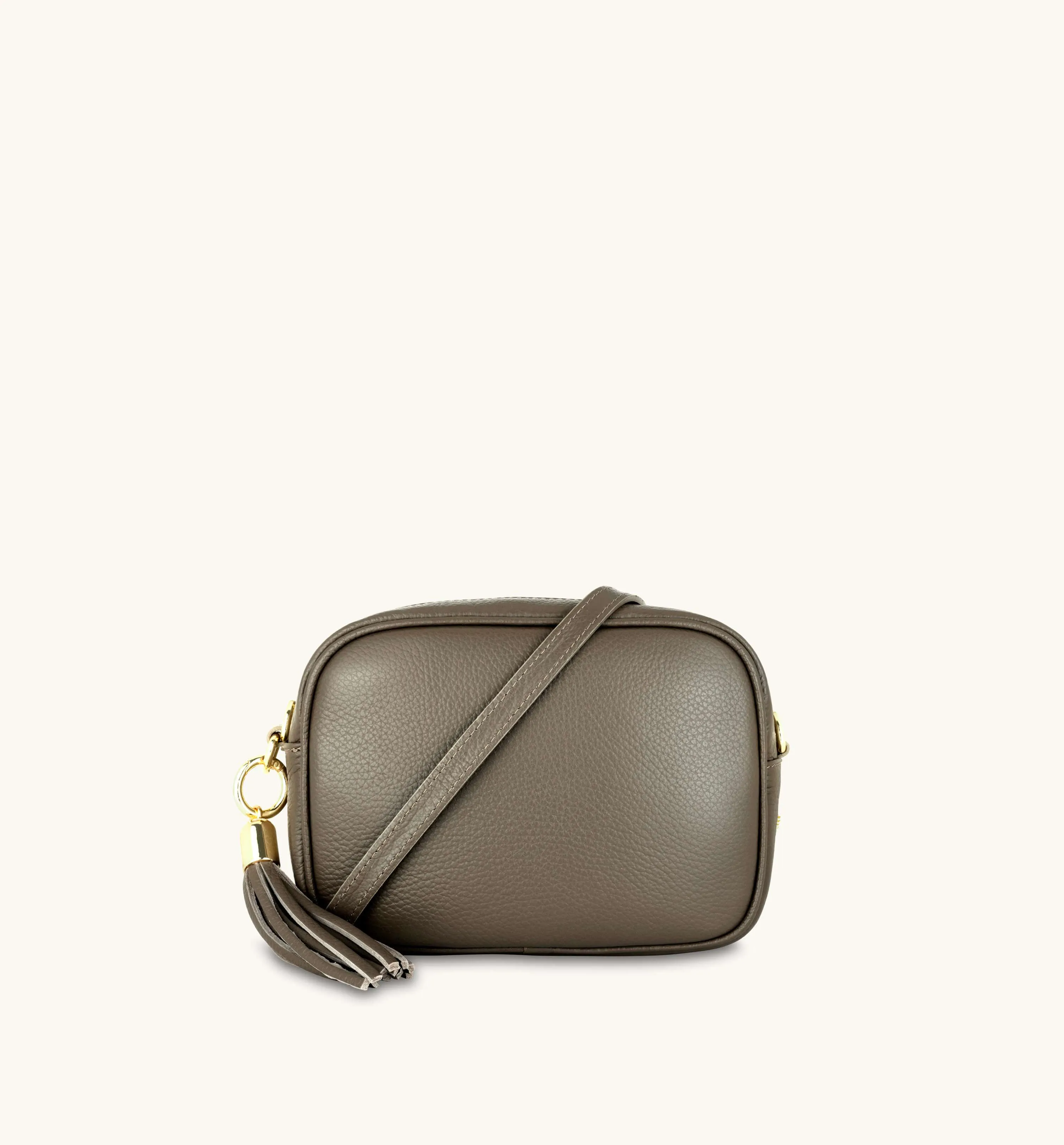 The Tassel Latte Leather Crossbody Bag With Black & Gold Chevron Strap