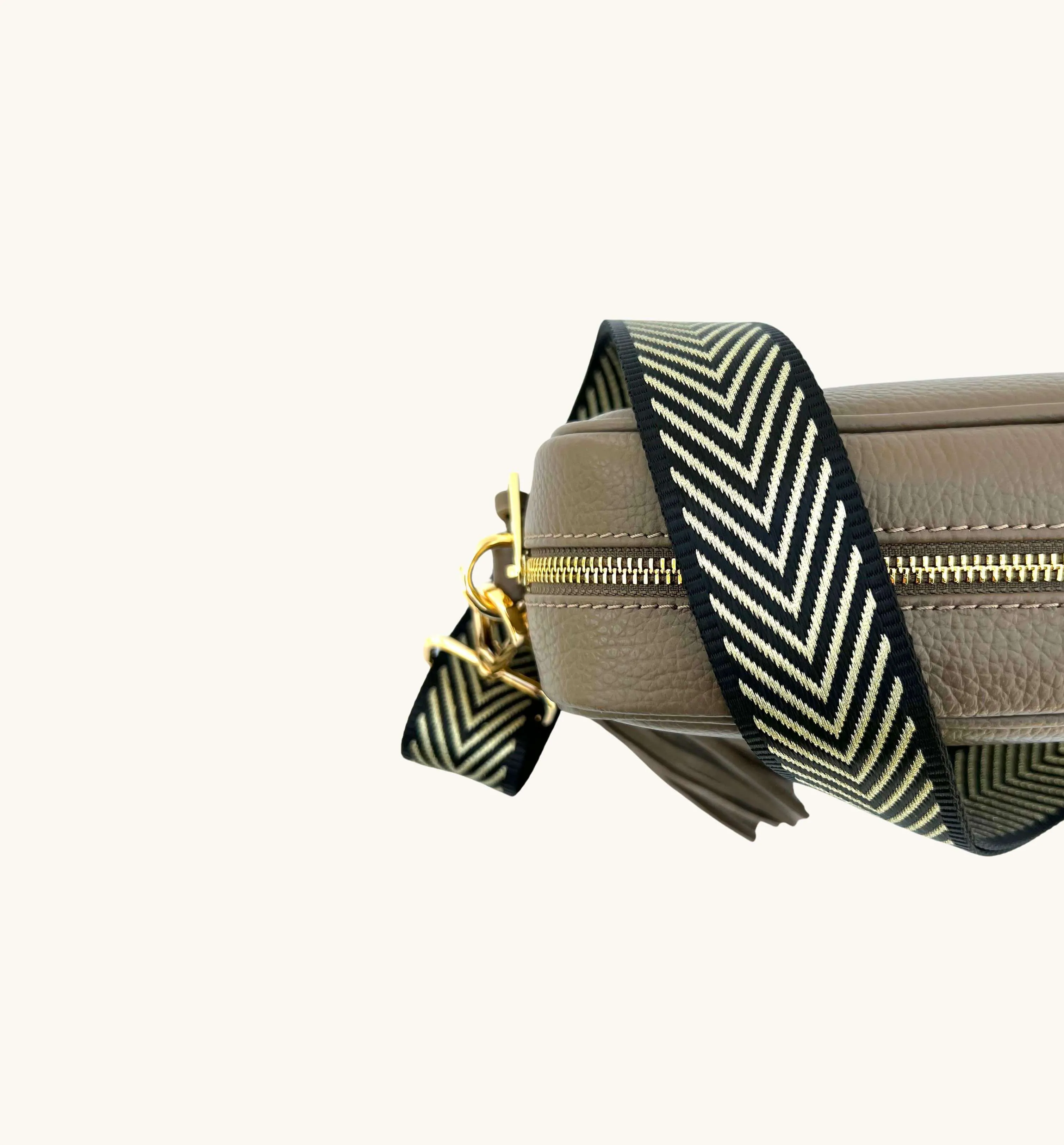 The Tassel Latte Leather Crossbody Bag With Black & Gold Chevron Strap