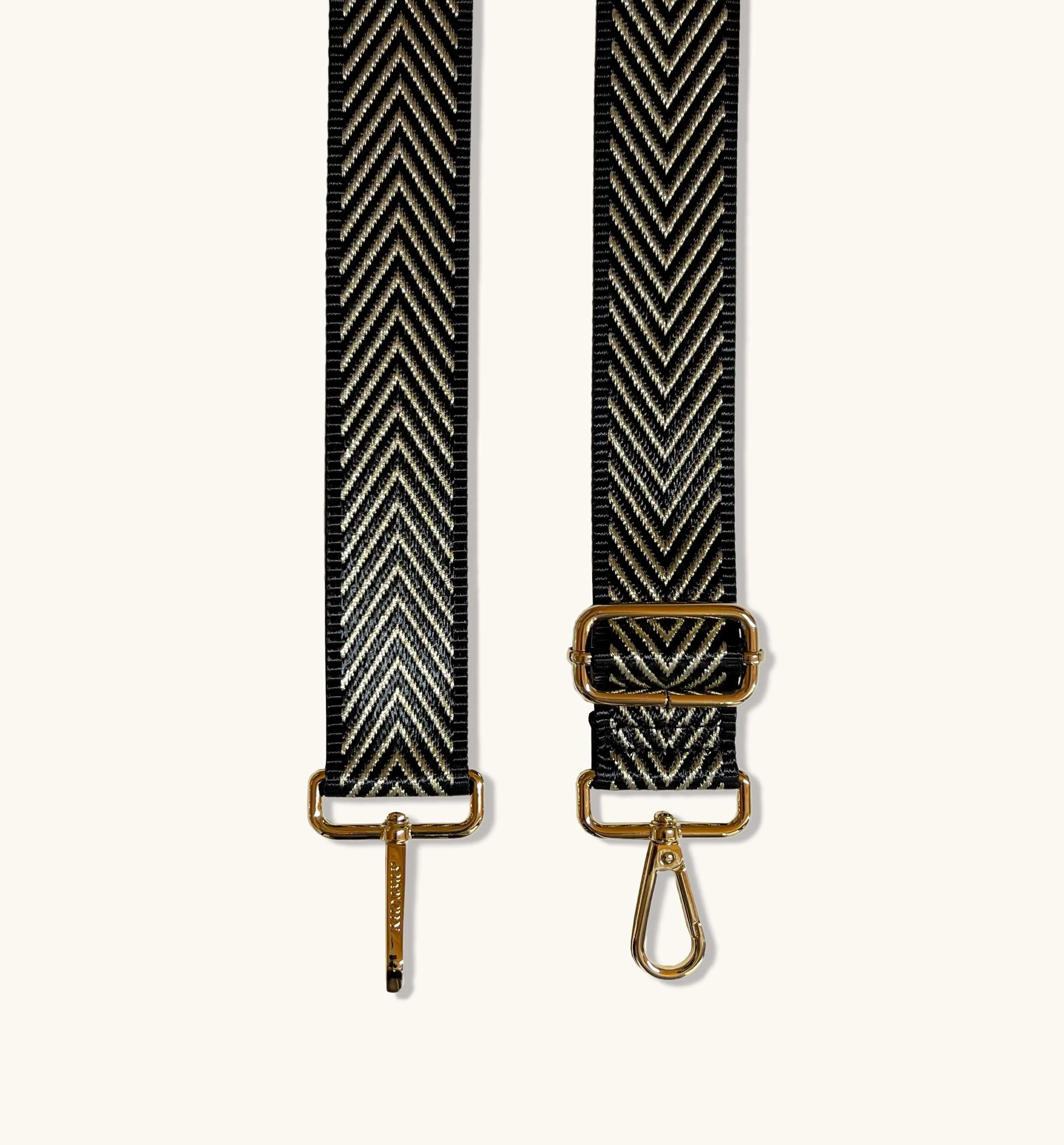 The Tassel Latte Leather Crossbody Bag With Black & Gold Chevron Strap