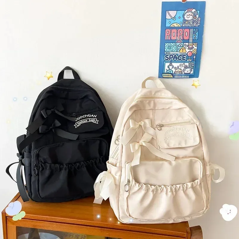 UAKISS  -  Fashion Backpack Women Canvas Anti-theft Shoulder Bag for Teenager Girls Bow School Laptop Travel Feminina Backapck Female 2024