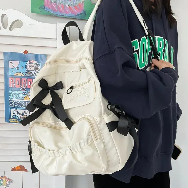 UAKISS  -  Fashion Backpack Women Canvas Anti-theft Shoulder Bag for Teenager Girls Bow School Laptop Travel Feminina Backapck Female 2024